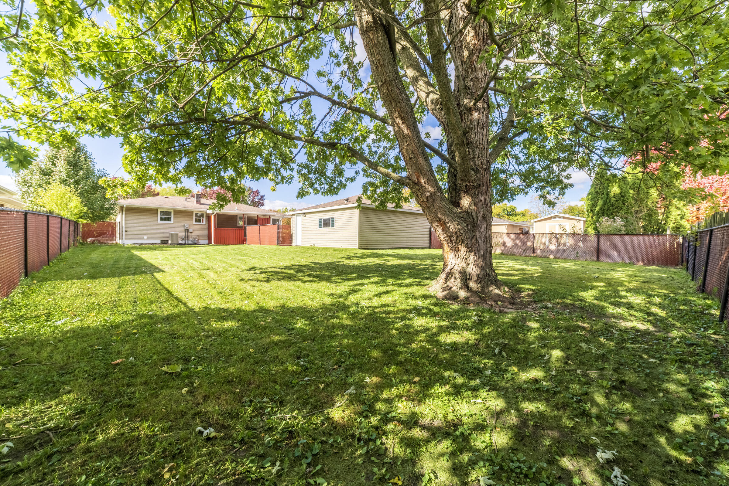 8749 Monroe Avenue Munster, IN 46321 - Photo 4 of 33 a view of a house with a yard