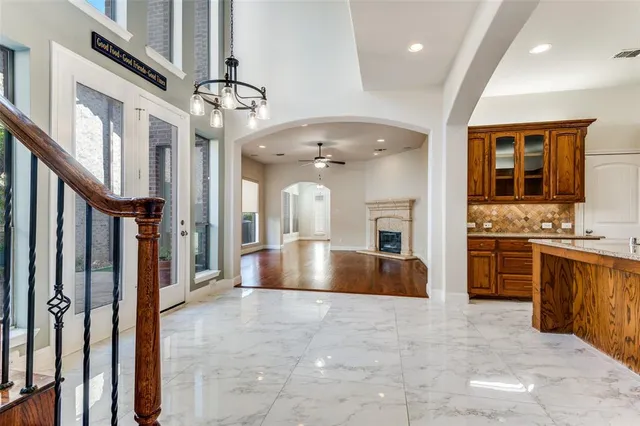 a living room with granite countertop furniture and a large mirror