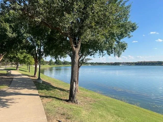 a picture of a room with a white and has a large window