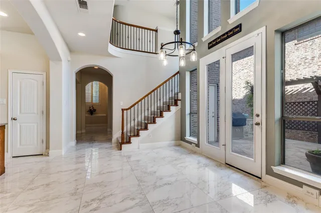 a view of entryway and hall with a front door