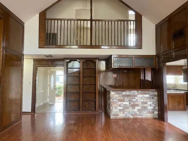 a view of a kitchen with furniture and a window