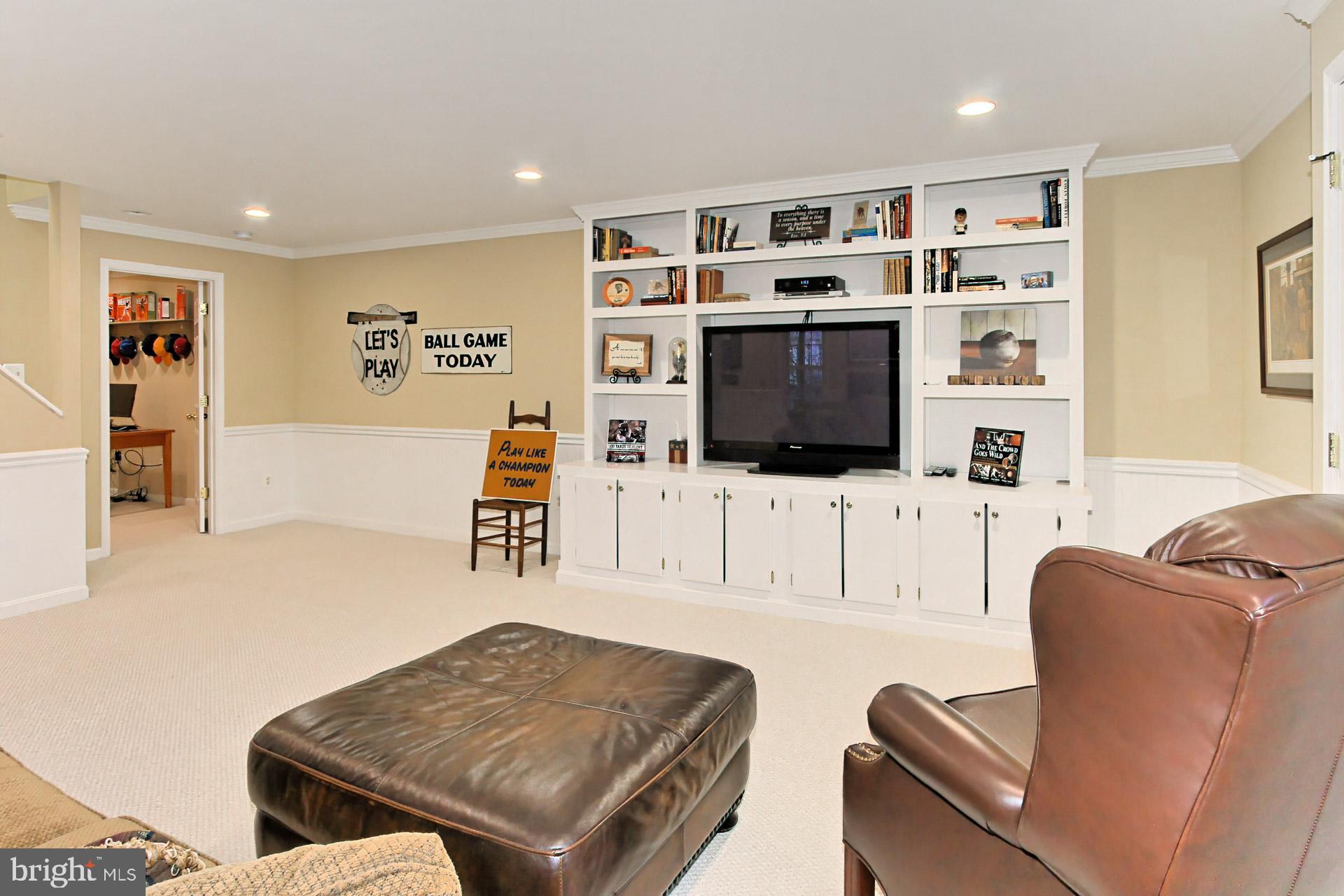 8126 Ridge Creek Way Springfield, VA 22153 - Photo 31 of 50 a living room with furniture and a flat screen tv