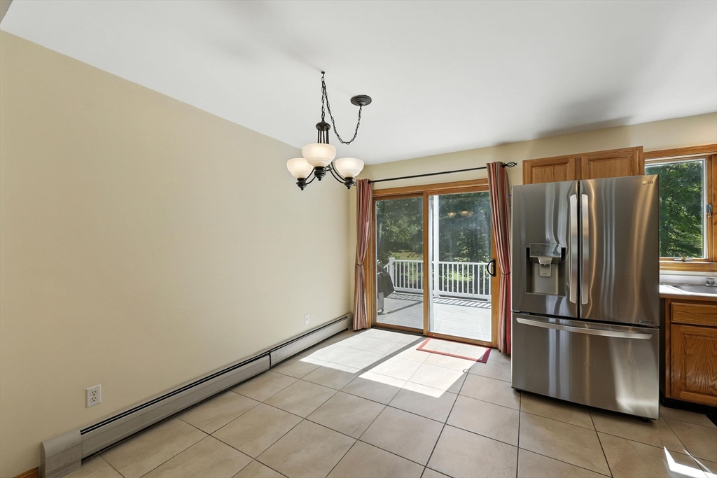 17 Glendale Road Southampton, MA 01073 - Photo 13 of 42 a view of a refrigerator in kitchen and an empty room