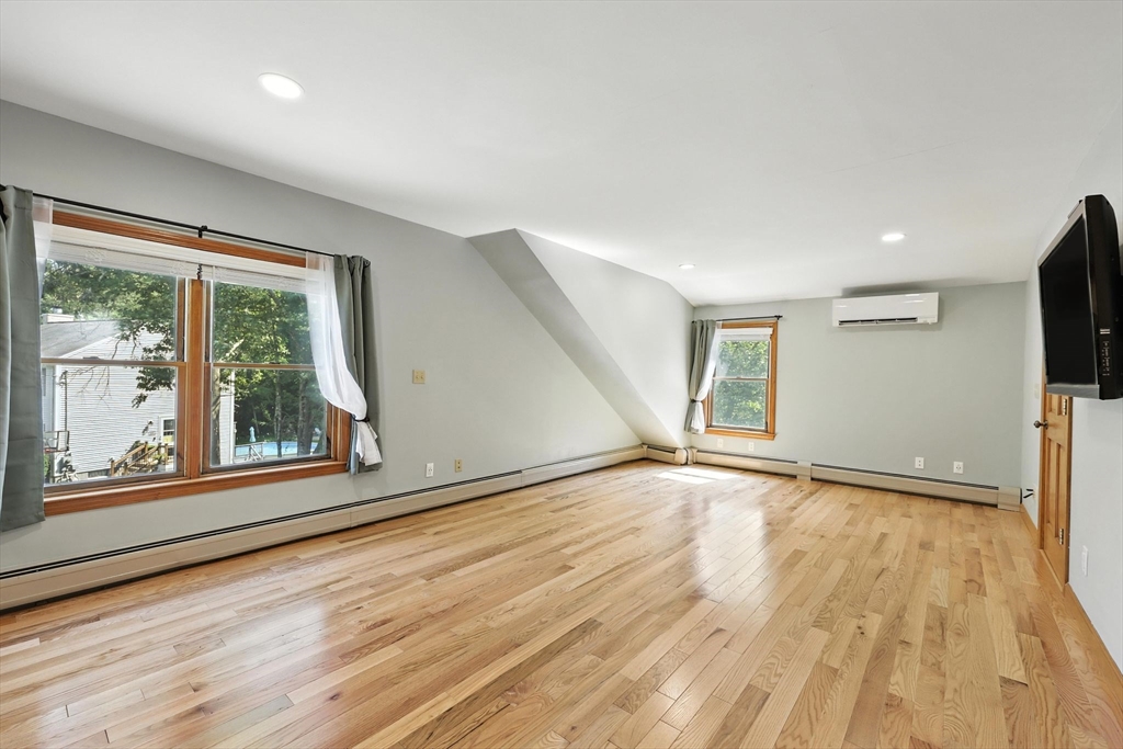 17 Glendale Road Southampton, MA 01073 - Photo 23 of 42 a view of an empty room with wooden floor and a window