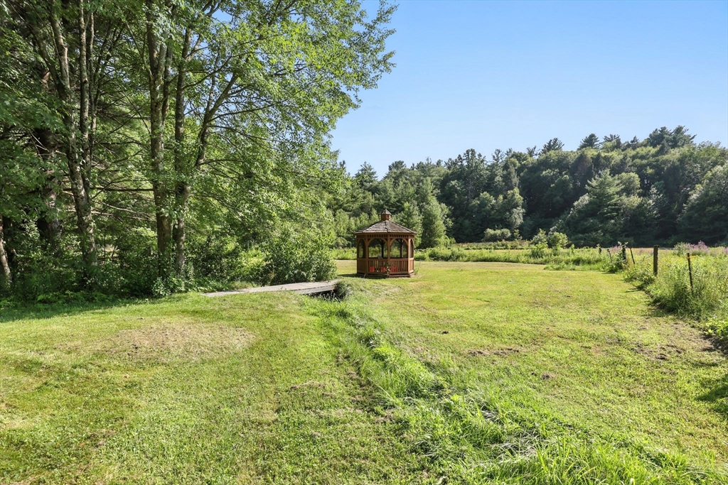 17 Glendale Road Southampton, MA 01073 - Photo 36 of 42 a backyard of a house with a yard and outdoor seating