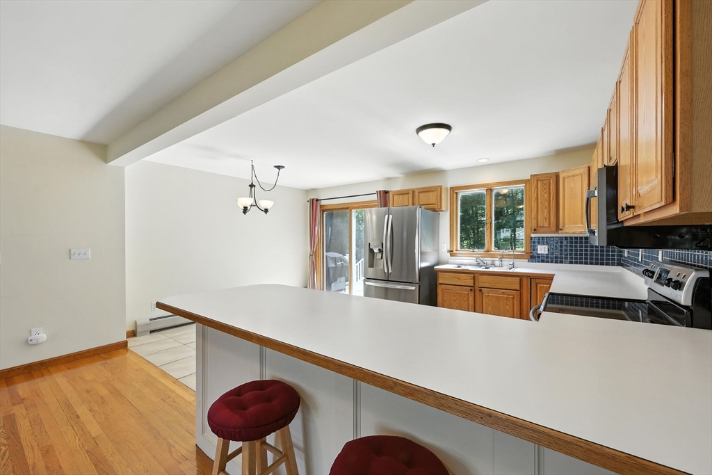 17 Glendale Road Southampton, MA 01073 - Photo 8 of 42 a kitchen with stainless steel appliances granite countertop a sink and a refrigerator