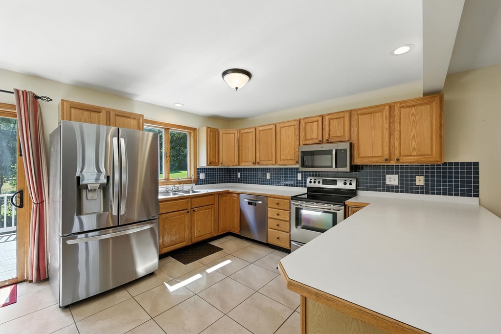 17 Glendale Road Southampton, MA 01073 - Photo 9 of 42 a kitchen with granite countertop stainless steel appliances a refrigerator sink and microwave