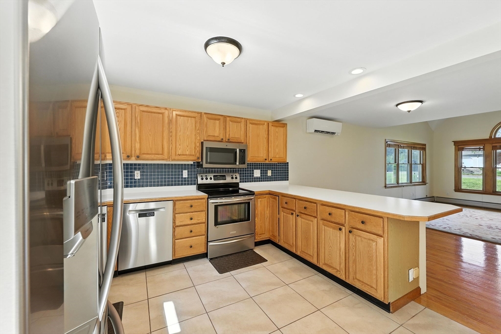 17 Glendale Road Southampton, MA 01073 - Photo 10 of 42 a kitchen with stainless steel appliances granite countertop a stove a sink and a refrigerator