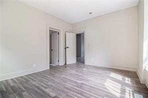 665 Lexington Avenue Southwest Atlanta, GA 30310 - Photo 17 of 33 a view of an empty room with wooden floor