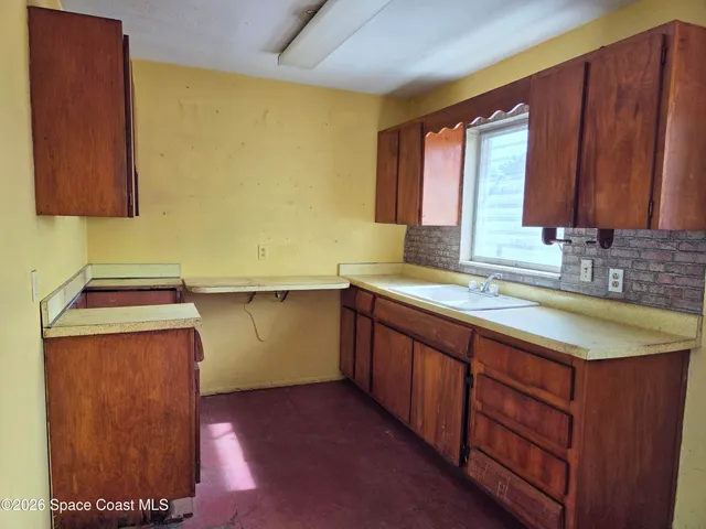 a kitchen with a sink and a cabinets