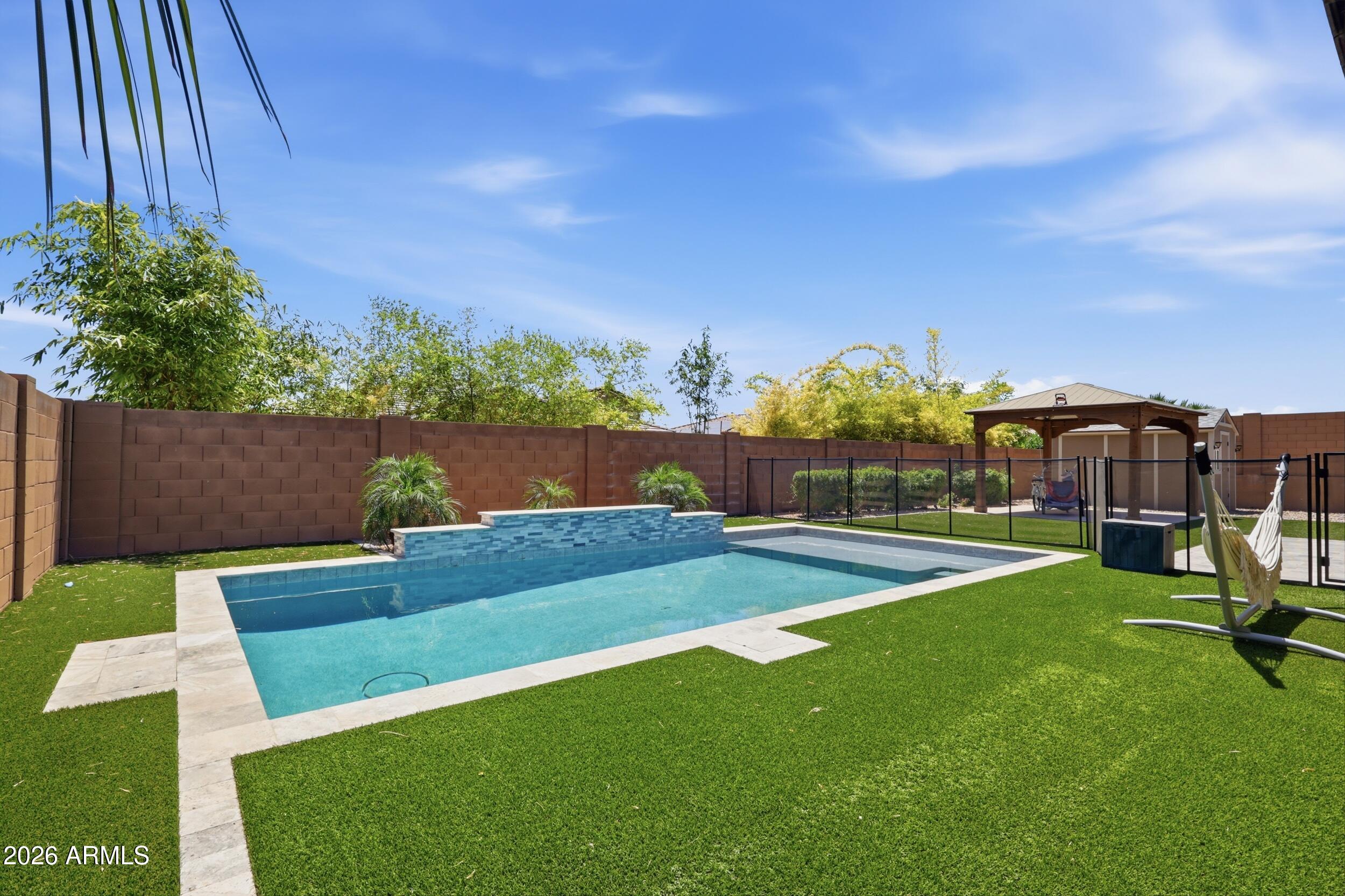 12517 West Lawrence Road Glendale, AZ 85307 - Photo 50 of 52 a view of a backyard with sitting area
