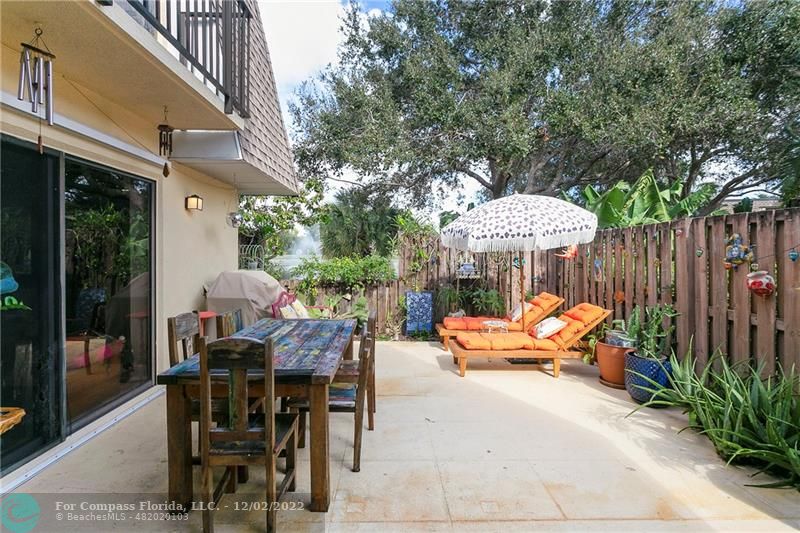 2929 Southwest 22nd Circle, Unit 32B Delray Beach, FL 33445 - Photo 6 of 22 a view of a patio with furniture and wooden floor