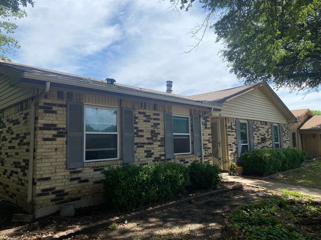 1109 Cross Bend Road Plano, TX 75023 - Photo 2 of 11 Brick exterior with contrasting dark grey shutters