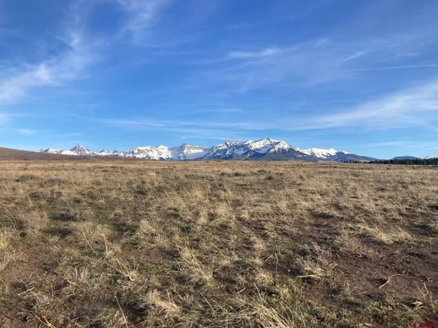 a view of a large body of water with mountain