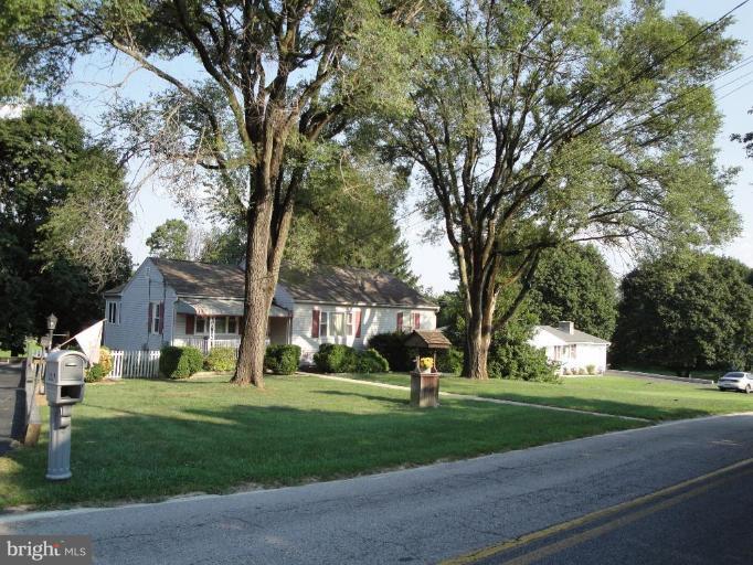 3317 Offutt Road Randallstown, MD 21133 - Photo 1 of 13 a front view of a house with a yard