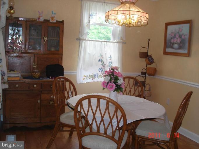 3317 Offutt Road Randallstown, MD 21133 - Photo 2 of 13 a view of a dining room with furniture window and outside view