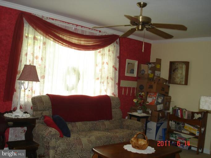 3317 Offutt Road Randallstown, MD 21133 - Photo 8 of 13 a living room with furniture and a window