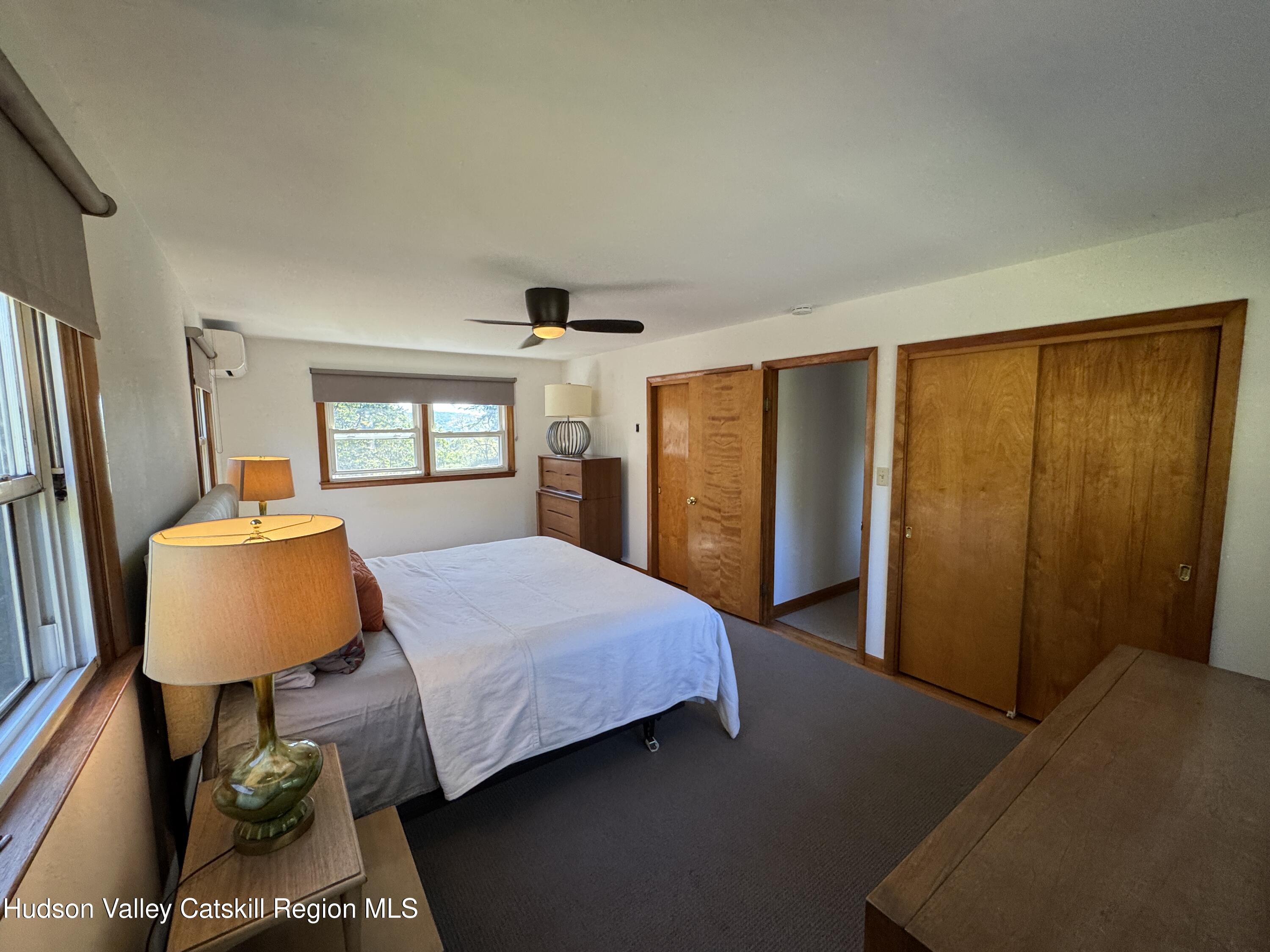 399 Hamburg Road Catskill, NY 12414 - Photo 13 of 23 a bedroom with a bed and wooden floor