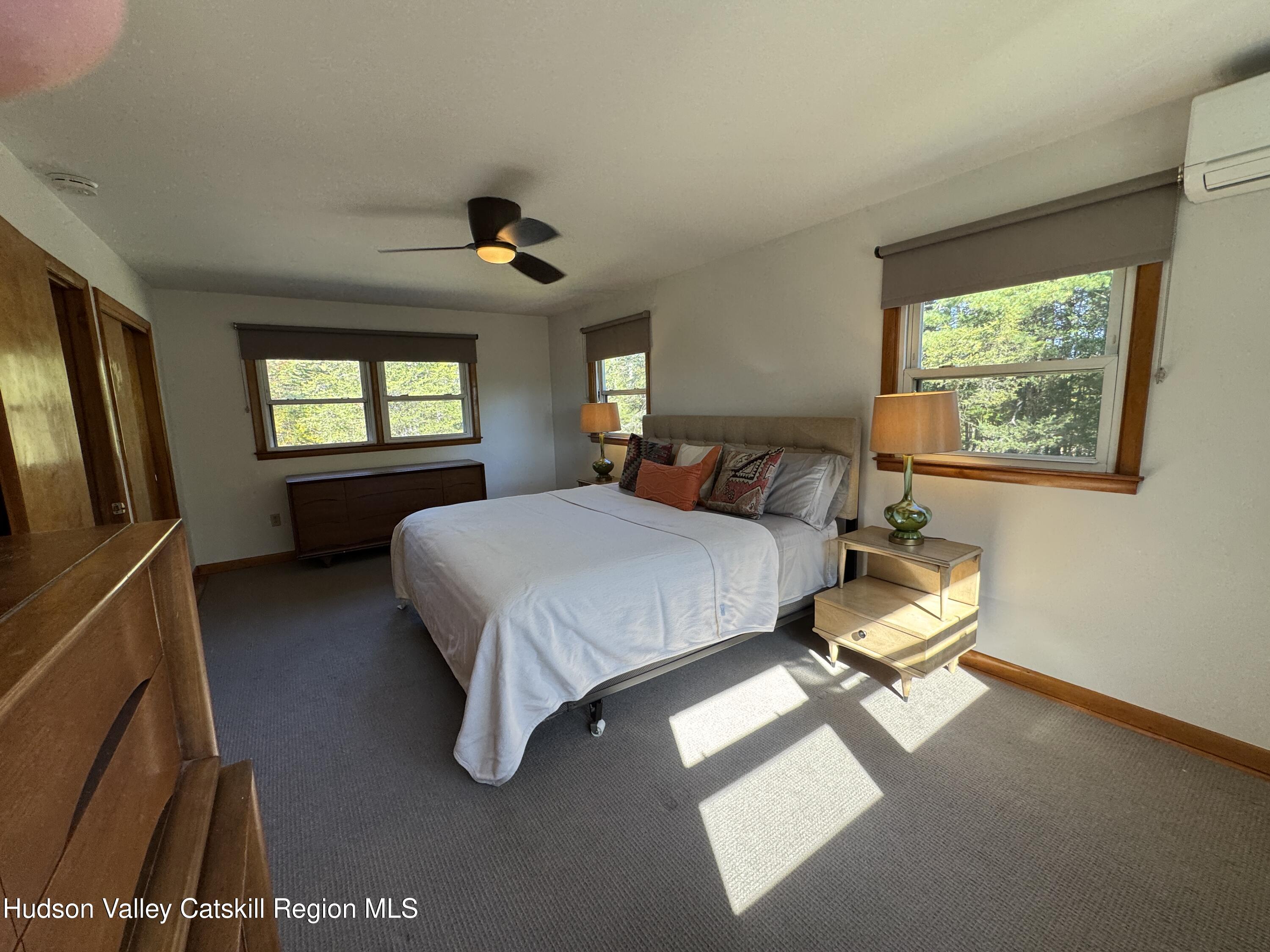 399 Hamburg Road Catskill, NY 12414 - Photo 14 of 23 a bedroom with a bed flat screen tv and window