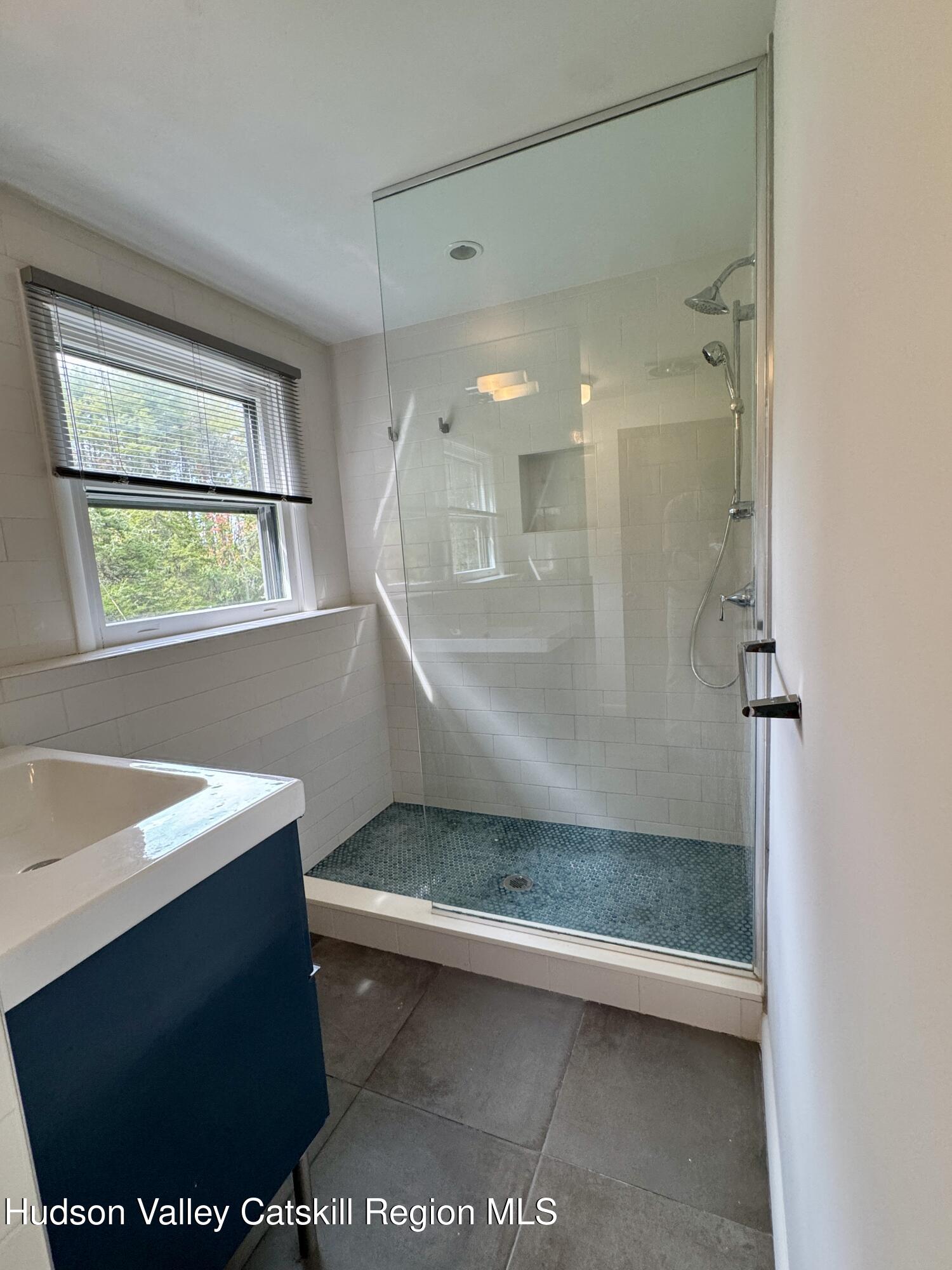 399 Hamburg Road Catskill, NY 12414 - Photo 15 of 23 a bathroom with a sink a toilet and shower