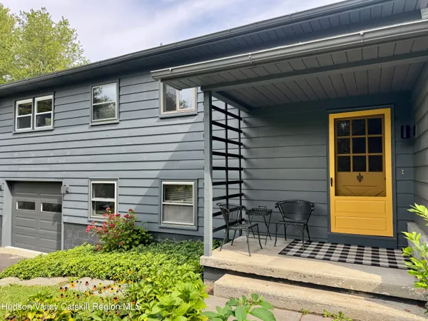 a front view of a house with yard