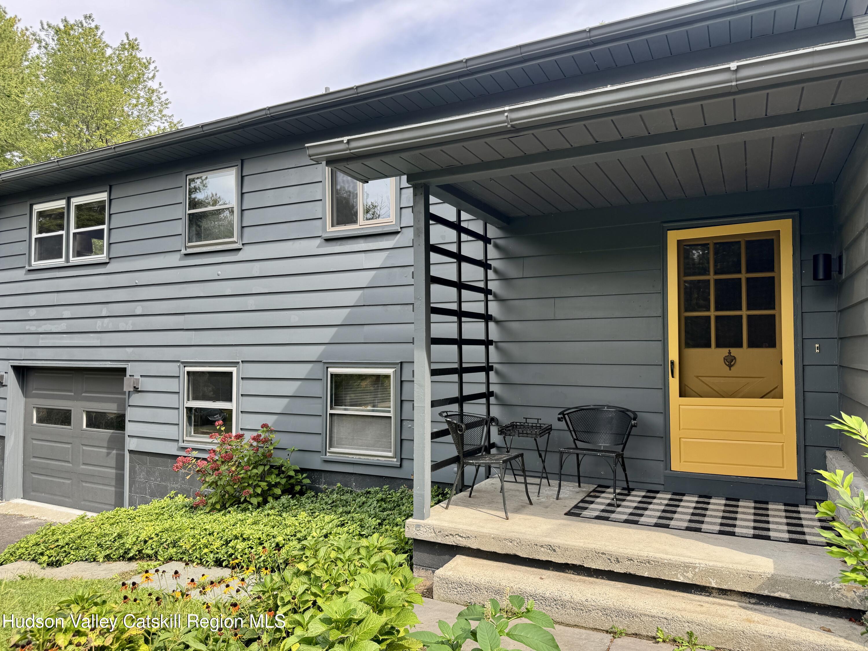 399 Hamburg Road Catskill, NY 12414 - Photo 20 of 23 a front view of a house with a garden