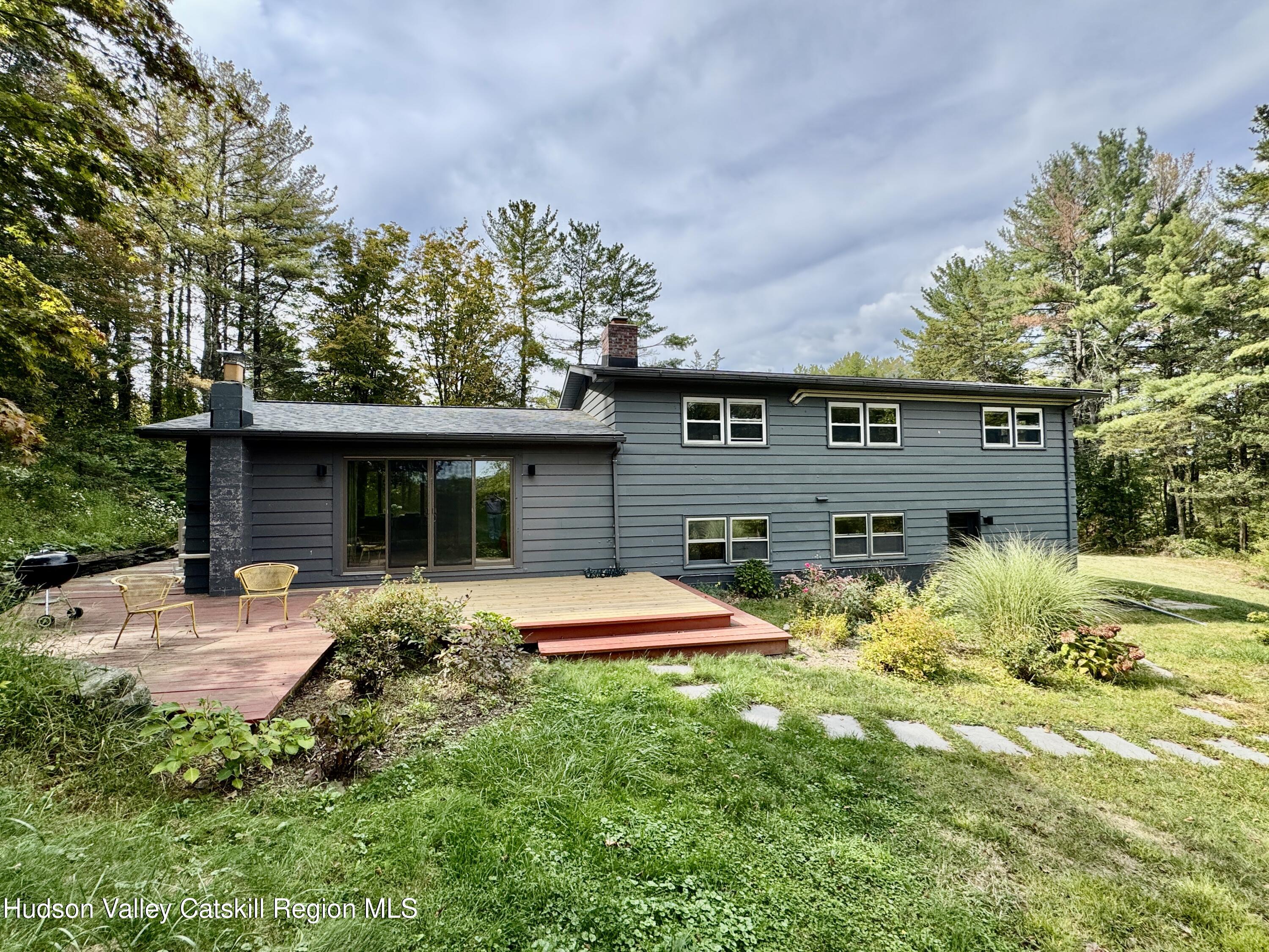 399 Hamburg Road Catskill, NY 12414 - Photo 3 of 23 a front view of house with yard and trees in the background