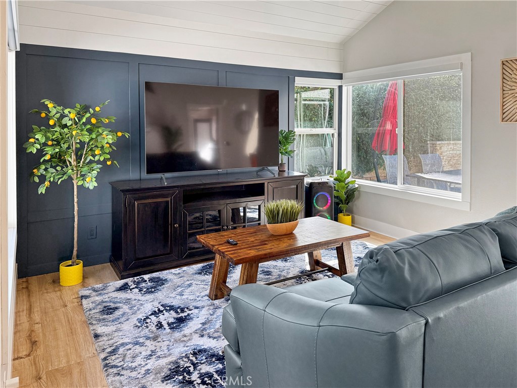 16955 Lake Knoll Parkway Riverside, CA 92503 - Photo 8 of 42 a living room with furniture a window and a flat screen tv