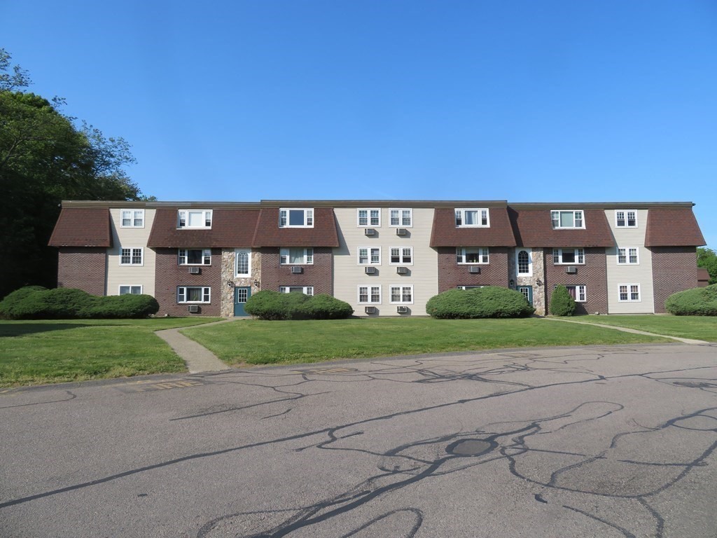 a view of a building with a yard