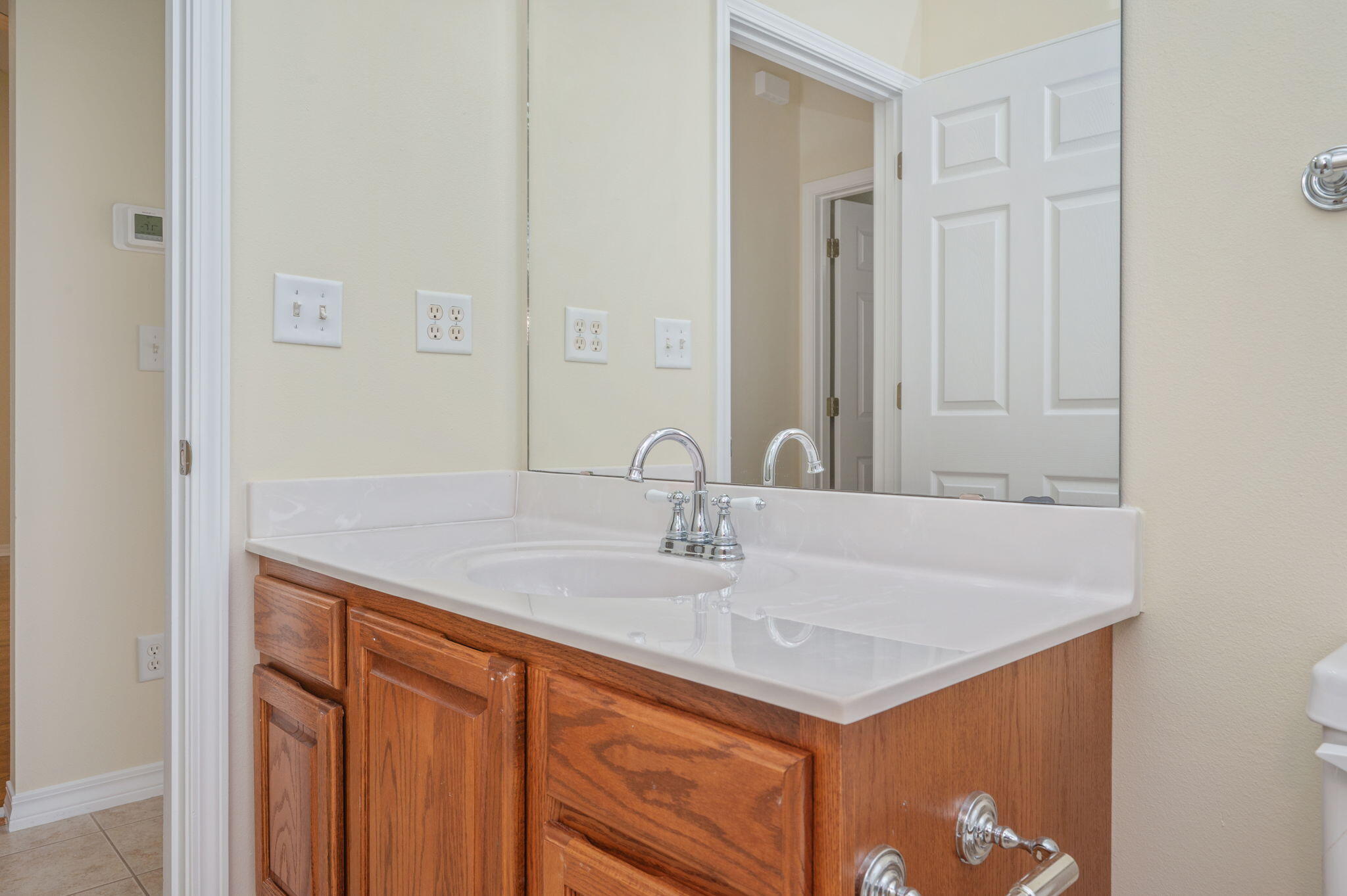 5552 Frontier Drive Crestview, FL 32536 - Photo 35 of 50 a bathroom with a sink and a mirror