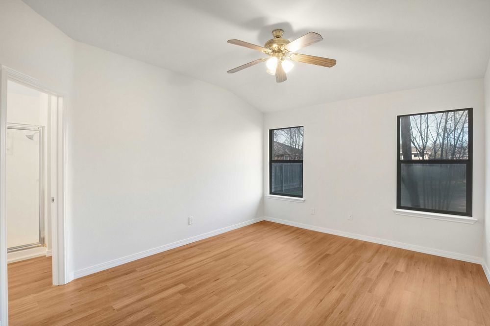 3310 Blue Ridge Drive Round Rock, TX 78681 - Photo 11 of 13 Hardwood floors and tall ceilings define this well-lit primary bedroom.
