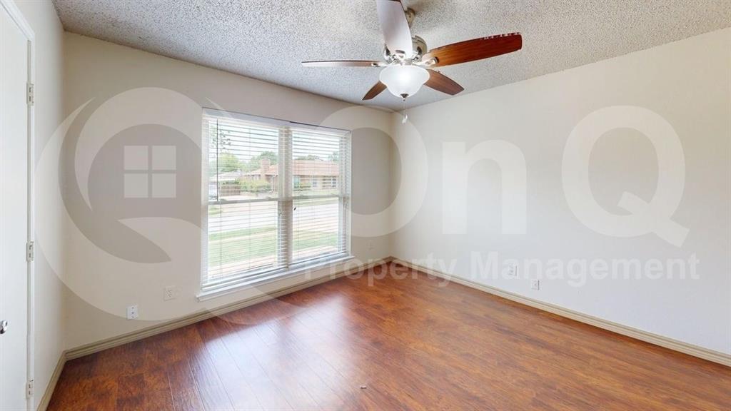3000 Timothy Lane Euless, TX 76039 - Photo 13 of 19 Bright room with wood-finish flooring and a white ceiling