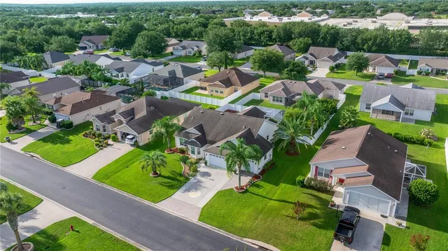 an aerial view of a house with a garden