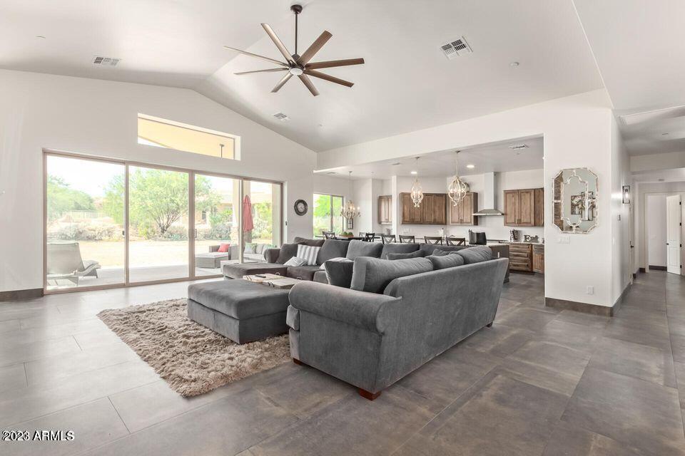 27808 Desierto Drive Rio Verde, AZ 85263 - Photo 10 of 44 a living room with furniture and a large window with kitchen view