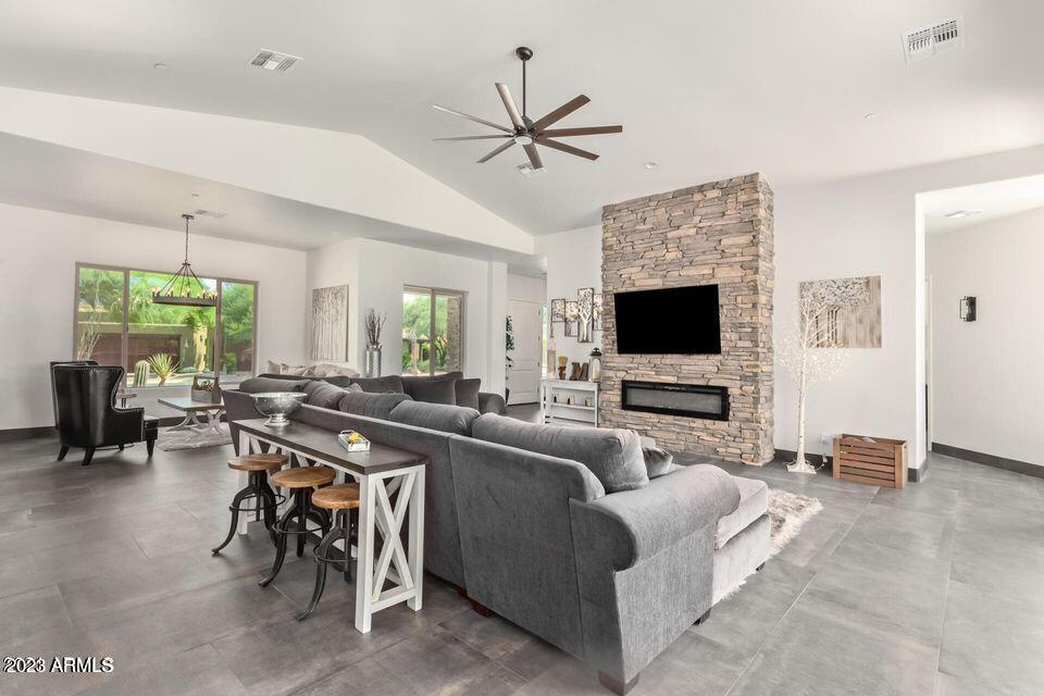 27808 Desierto Drive Rio Verde, AZ 85263 - Photo 11 of 44 a living room with furniture a flat screen tv and a window