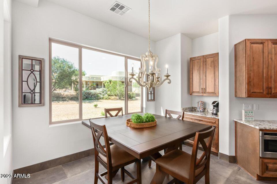 27808 Desierto Drive Rio Verde, AZ 85263 - Photo 18 of 44 a view of a dining room with furniture window and outside view