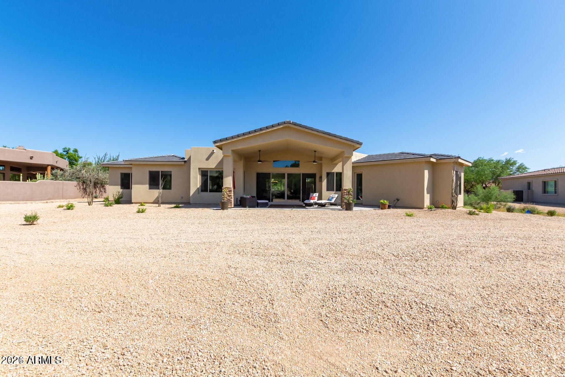 27808 Desierto Drive Rio Verde, AZ 85263 - Photo 2 of 44 a front view of a house with a yard