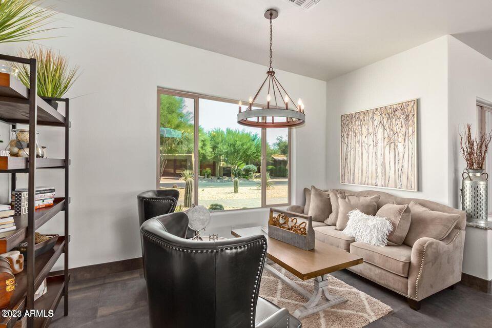 27808 Desierto Drive Rio Verde, AZ 85263 - Photo 20 of 44 a living room with furniture and a chandelier