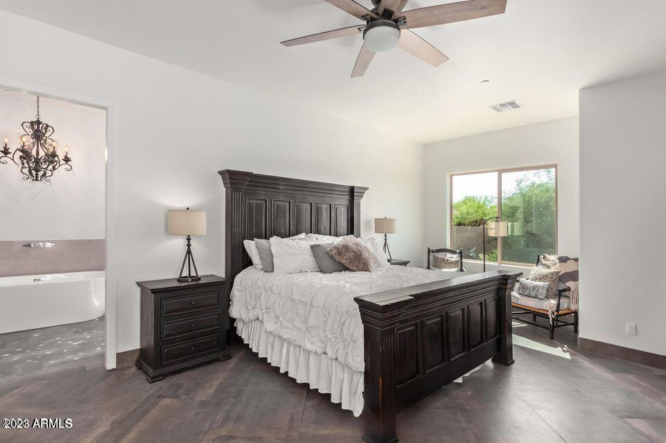 27808 Desierto Drive Rio Verde, AZ 85263 - Photo 22 of 44 a bedroom with a bed and a window