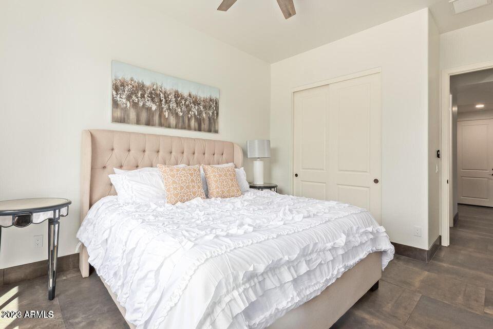 27808 Desierto Drive Rio Verde, AZ 85263 - Photo 29 of 44 a bedroom with a bed and a night stand