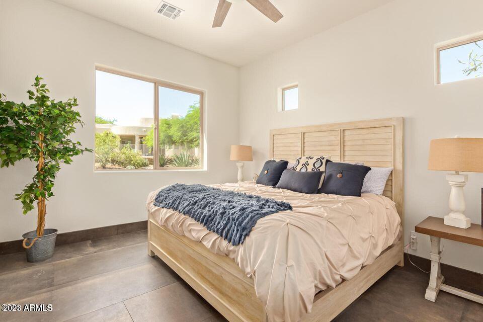 27808 Desierto Drive Rio Verde, AZ 85263 - Photo 31 of 44 a large bed sitting in a bedroom next to a window
