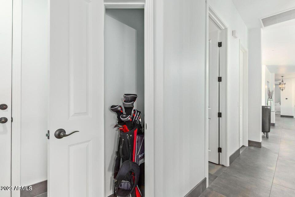 27808 Desierto Drive Rio Verde, AZ 85263 - Photo 34 of 44 a view of a hallway with wooden walls