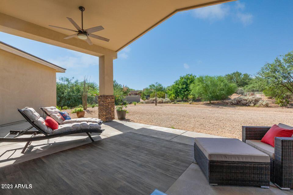 27808 Desierto Drive Rio Verde, AZ 85263 - Photo 5 of 44 a living room with furniture a window and a flat screen tv