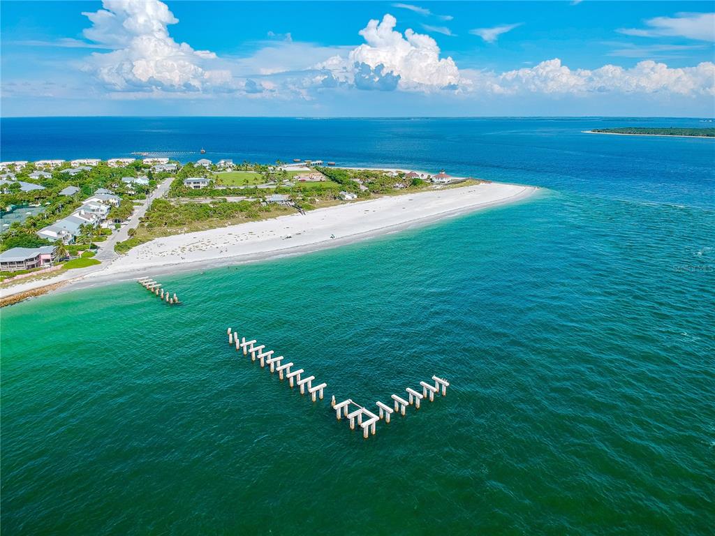8465 Gasparilla Road Port Charlotte, FL 33981 - Photo 15 of 17 a view of an ocean and a building