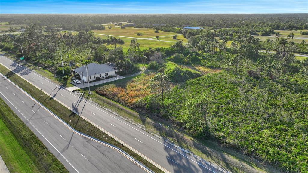 8465 Gasparilla Road Port Charlotte, FL 33981 - Photo 9 of 17 a view of a balcony with an outdoor seating