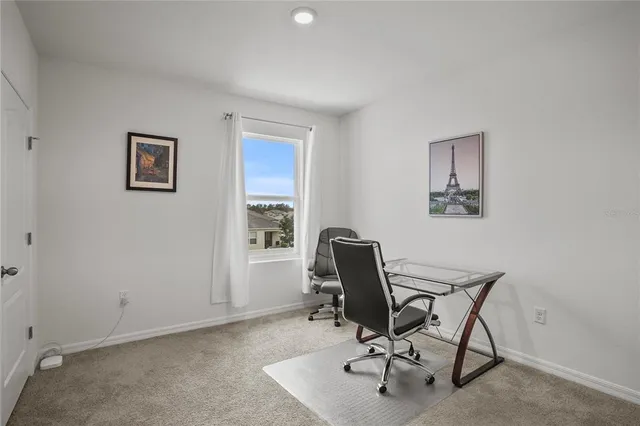 a view of a workspace with furniture