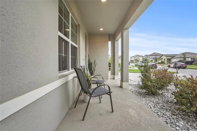 a view of balcony with furniture