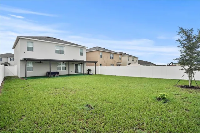 a view of a house with a back yard