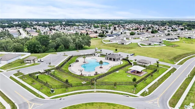 a sign that is sitting in front of flowers