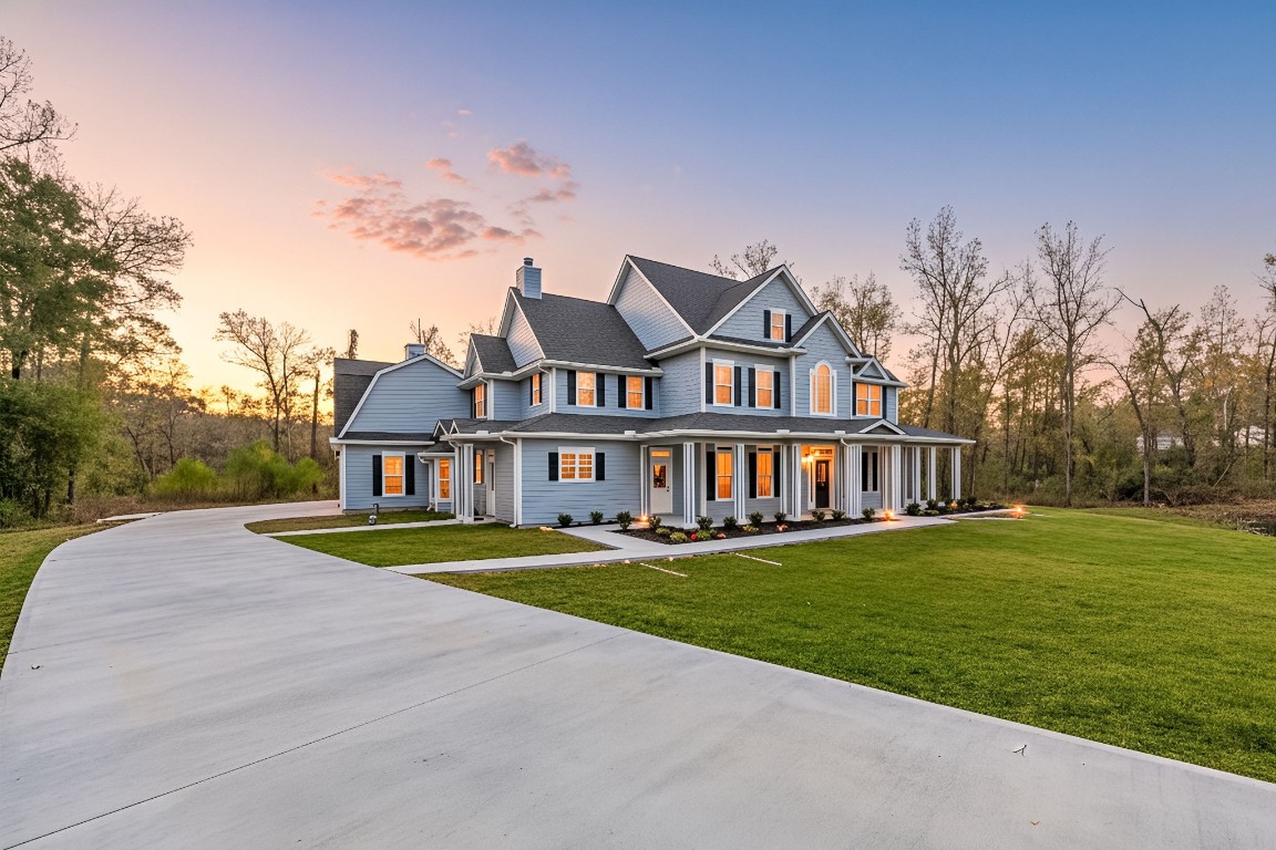 Welcome to 14882 Gingham! This two-story home has a wraparound porch, surrounded by a large, well-maintained lawn.